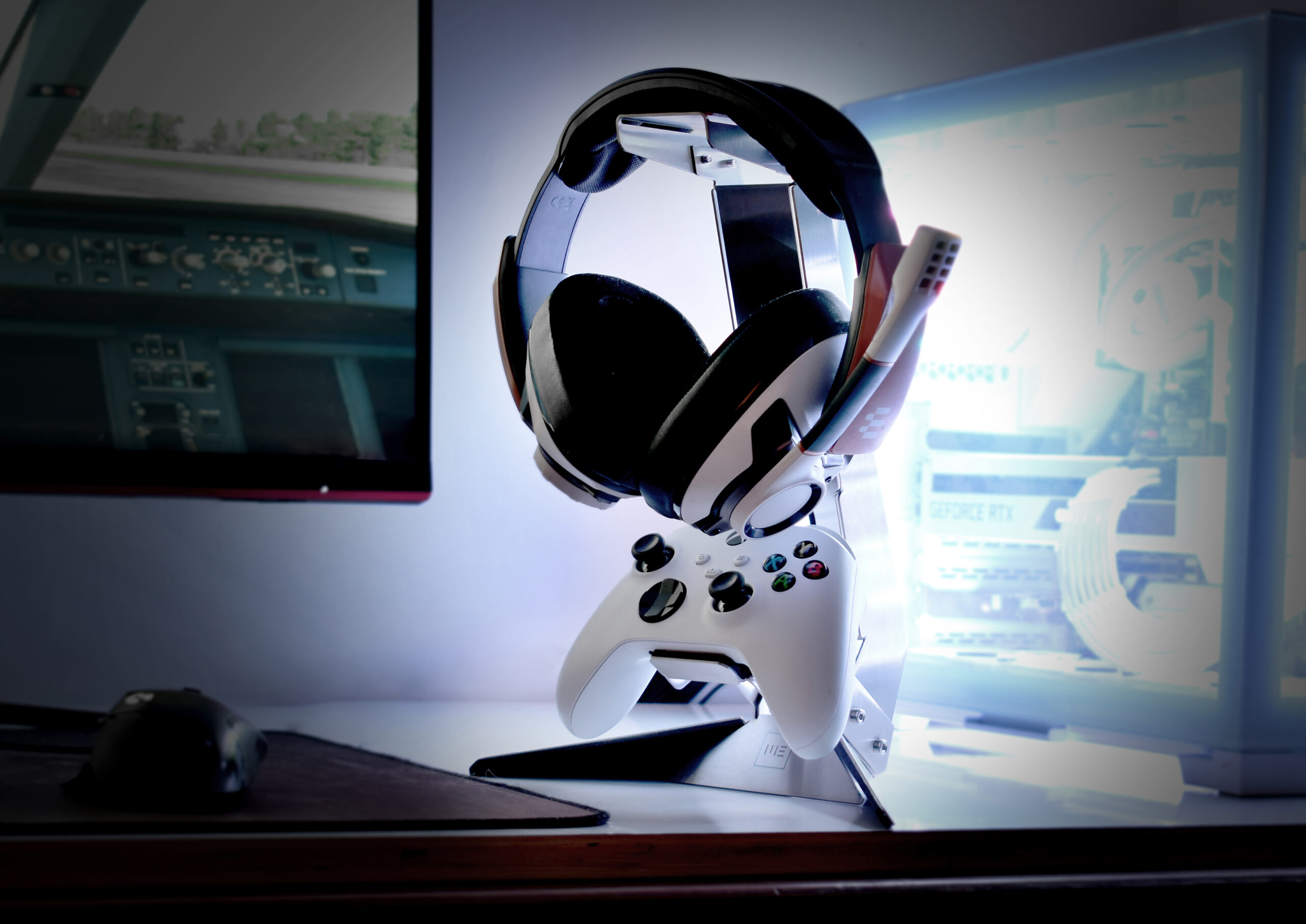 The fully assembled headphone and controller stand on a desk setup, showcasing its sleek and minimal design.